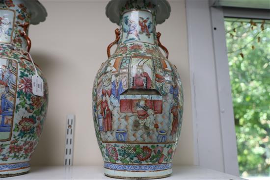 A pair of Chinese famille rose vases, 19th century, H. 45cm, one with section of rim lacking